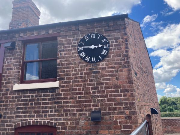 A clock on a brick building.