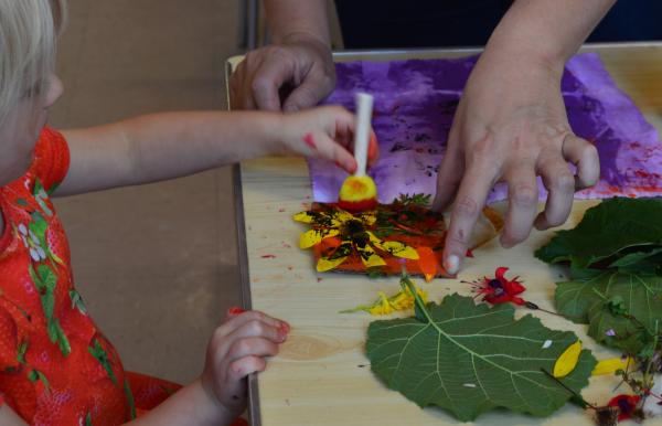 A child doing flower printing