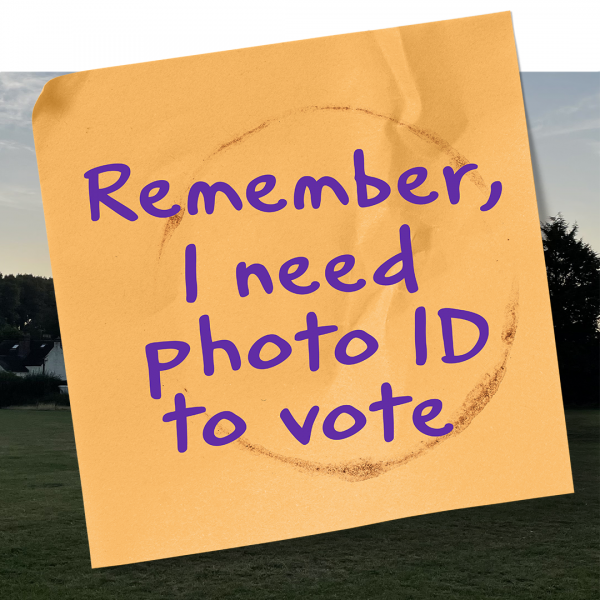 Post it note with text reading: 'Remember, I need photo ID to vote