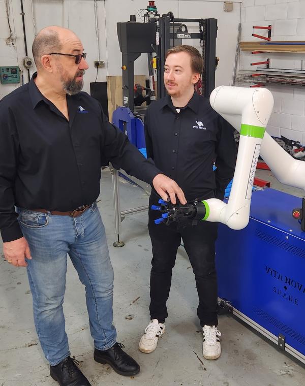 Vita-Nova Solutions' director Paul Millard with design director and son Keanu and one of their automation services products.