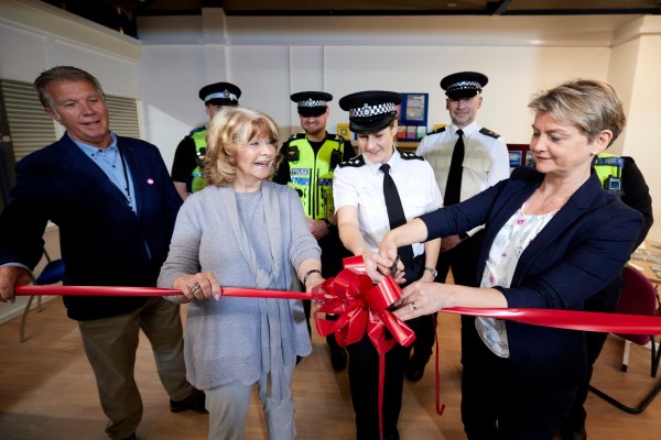 A photo of Cllr Denise Jeffery, Yvette Cooper MP and members of the police cutting a ribbon