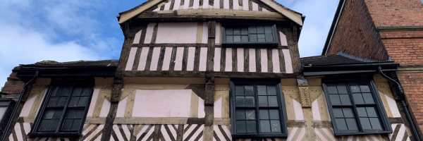A photo of a building with an old timber frame