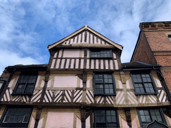A photo of a building with a Tudor timber frame