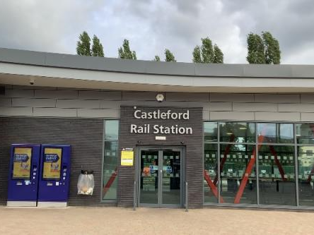A photo of Castleford Rail Station, with two ticket machines outside