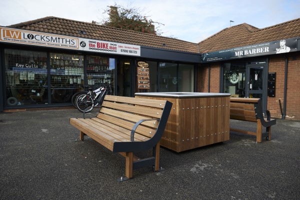 A photo of some new benches installed at Normanton Market, in front of shop units