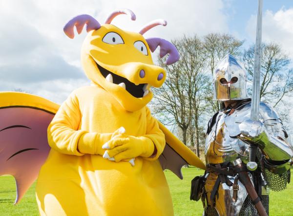 Ilbert the Dragon and Dave the Knight outside on the bailey at Pontefract Castle.