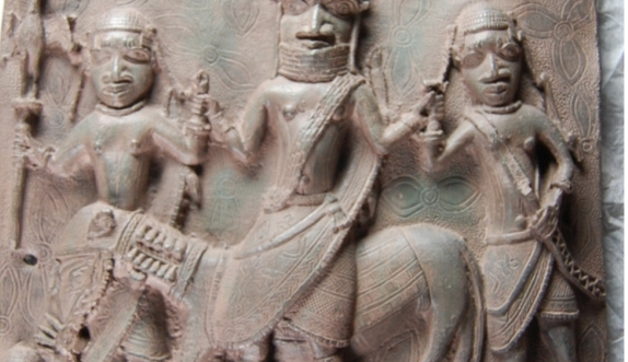 a bronze plaque from the Benin Kingdom featuring soldiers on horseback
