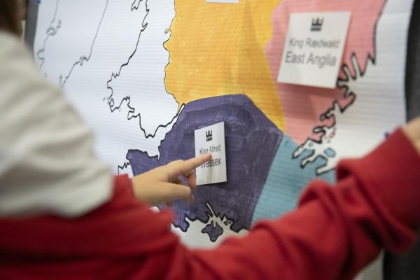 child's hand pointing at a map of Saxon England