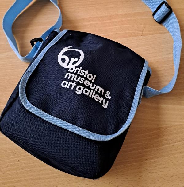 a blue small bag with words bristol museum & art gallery on it