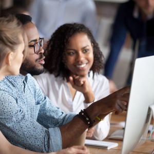 People looking and pointing at a screen