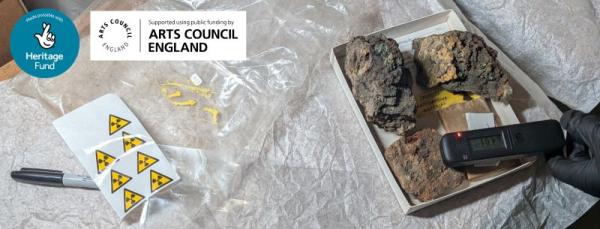 A tray of rocks and a Geiger counter
