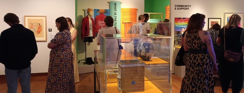 A gallery of people looking at coluorful art