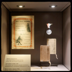 A small display of a letter and a medal