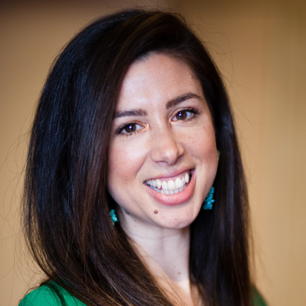 A smiling woman with long dark hair. 