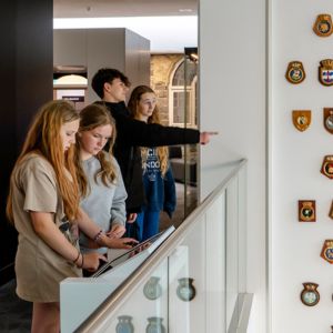 Four teenagers in a museum