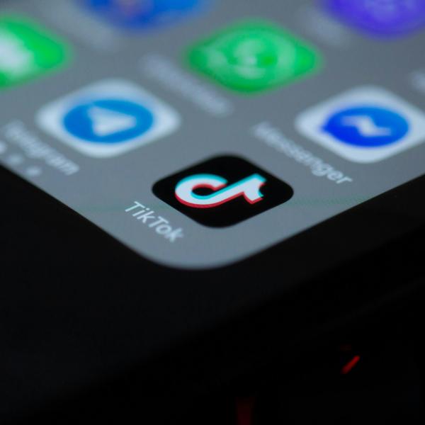 TikTok app icon shown on a smartphone