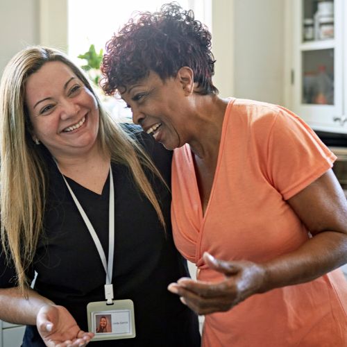 Two people smiling and laughing