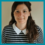 A profile picture of a person wearing a striped top with white collars. They are smiling at the camera and have long dark hair