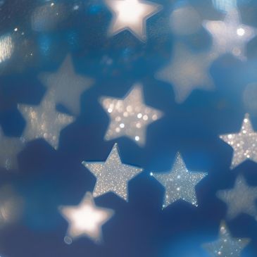 Silver stars floating against a blue background