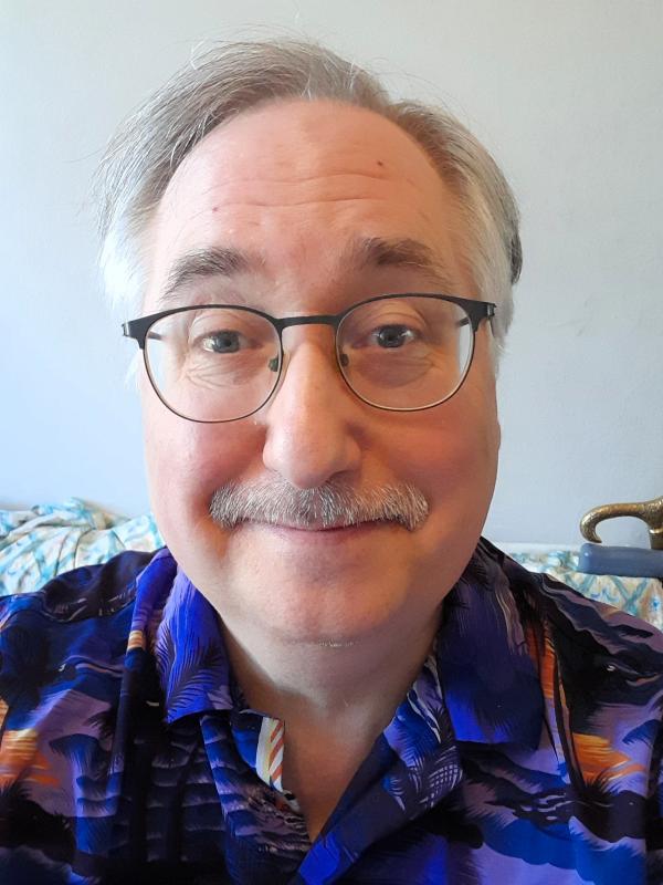 An Avenues colleague wearing a funky purple shirt.