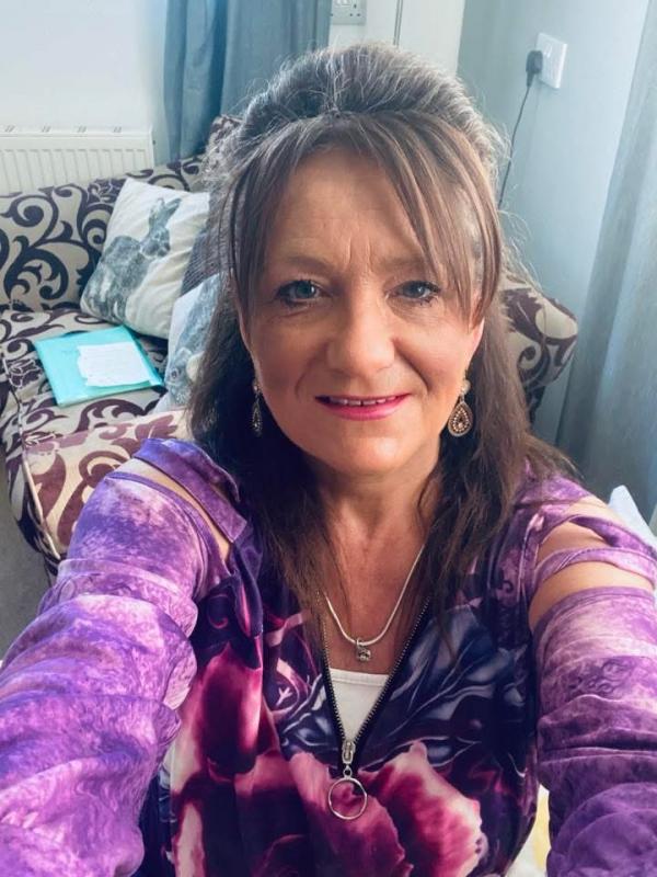 An Autism Hampshire colleague poses in purple.