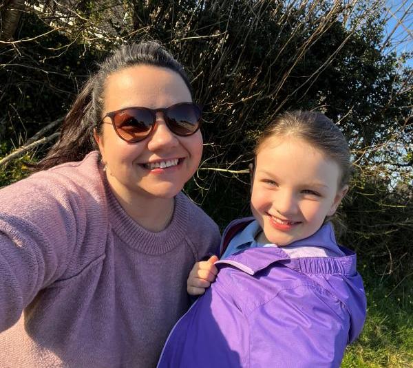 An Autism Hampshire colleague poses with her daughter on the way to school wearing purple.