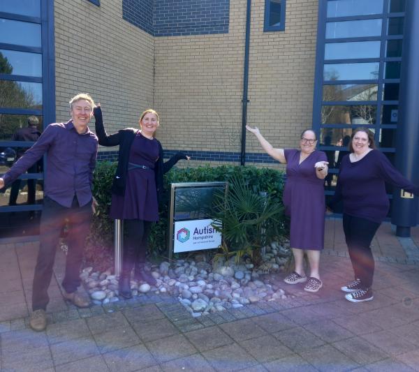 Colleagues gather outside the Autism Hampshire offices all wearing purple.