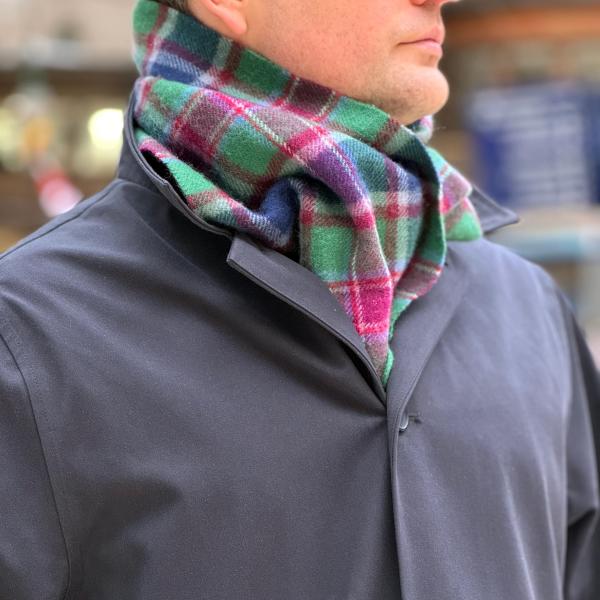 Man wearing Caledonian Sleeper tartan scarf