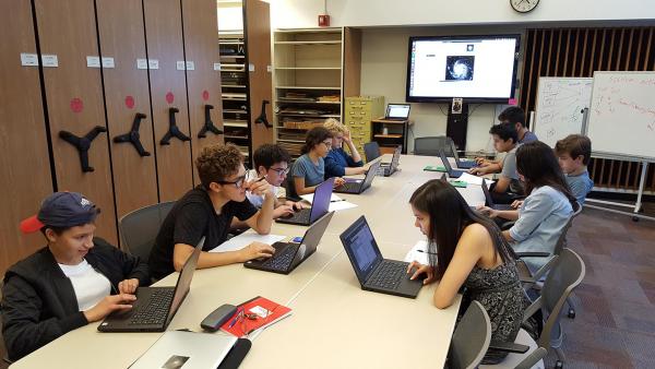 Students looking at computers