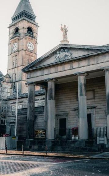 An historic building front with columns