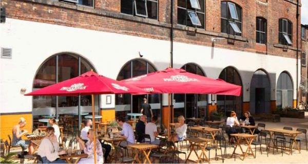 People sitting outdoors outside a cafe