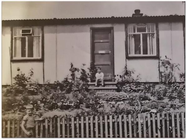 two young children outside a house in Eastmoor. Black and white historic photo.