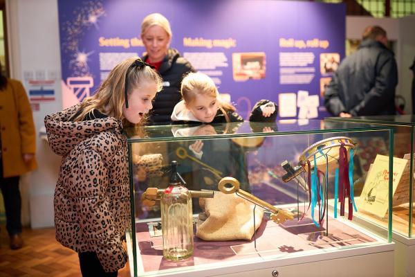 Two children looking at objects in Oh Yes It Is! exhibition at Pontefract Museum