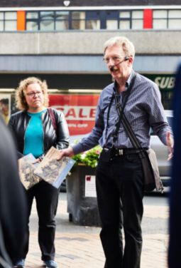 A person delivering a tour in Wakefield City Centre