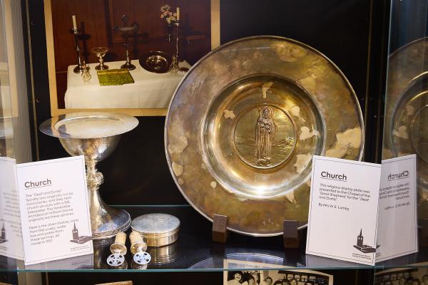 Church chalice, corks and wafer box on display