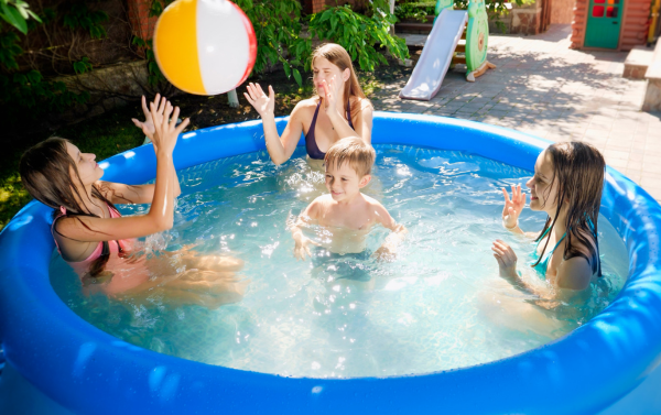 children playing in a paddling pool
