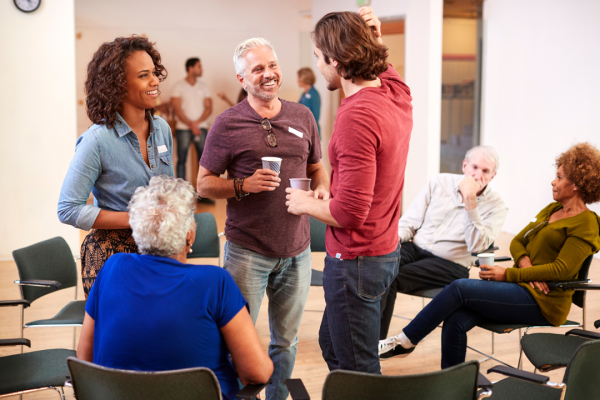 Residents enjoy a get together in a community room