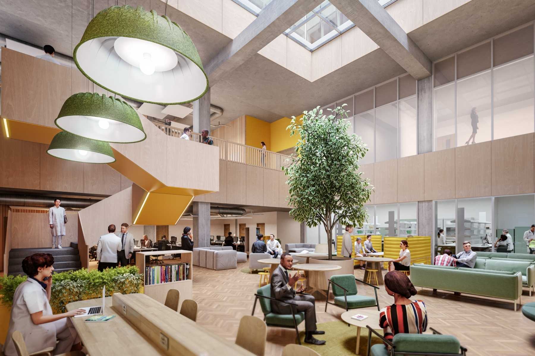 The atrium of Cambridge Children's Research Institute. It has high ceilings with lots of glass, planting inside, table and chairs, and sofas. the labs are across the room