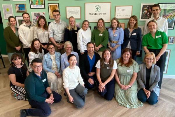 A group of around 20 people smiling together. These are the first of the Cambridge Children's Hospital Frontrunners
