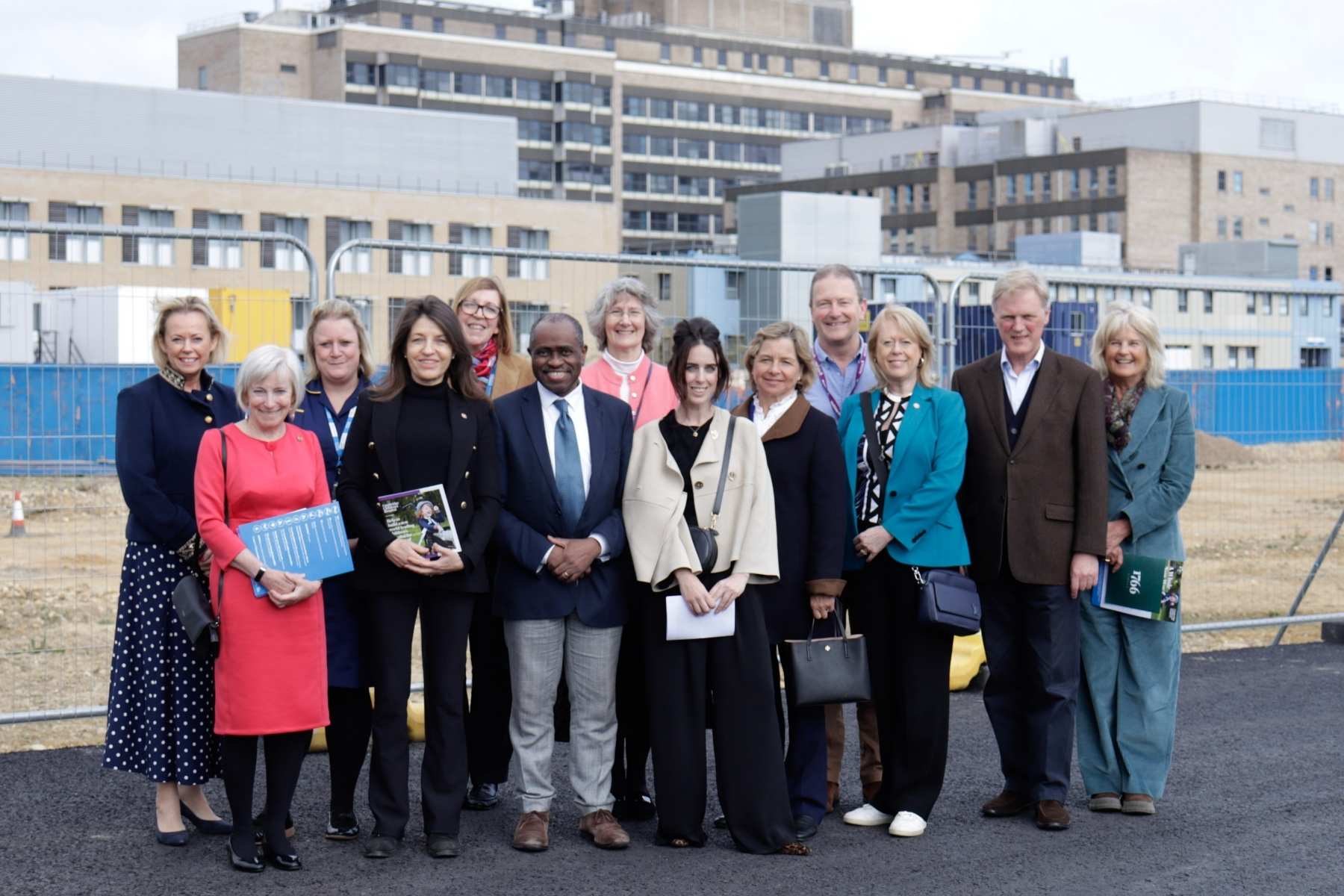 A group of people in front of the Cambridge Children's Hospital site on a visit