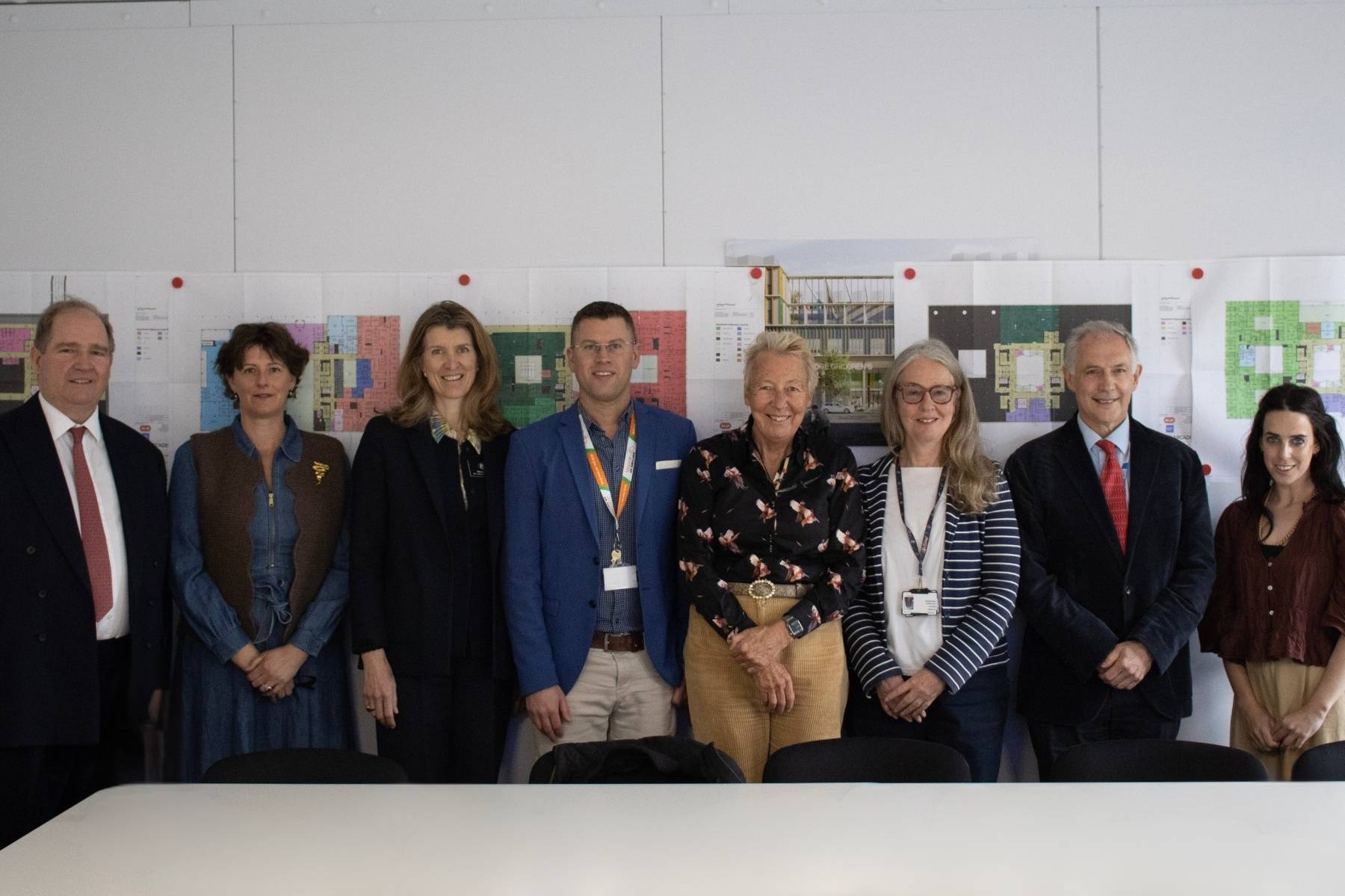 A group of people standing together in a room on a Cambridge Children's Hospital visit